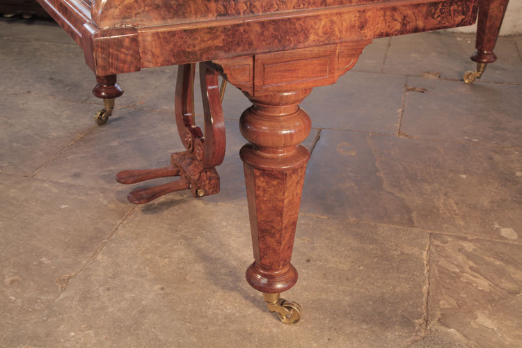 Broadwood turned, faceted piano leg with brass collared, casters