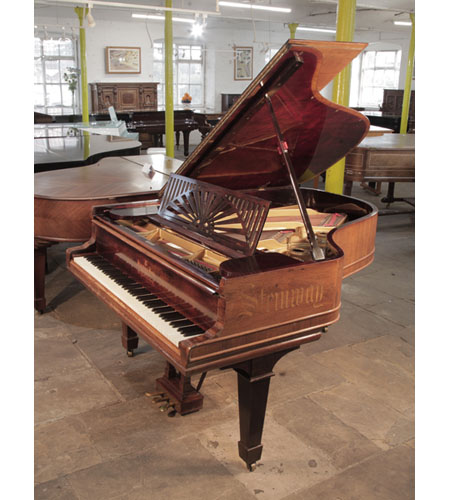 Reconditioned,  1911, Steinway Model A grand piano for sale with a polished, rosewood case. The Steinway name is inlaid on the piano cheek in calligraphy style. 