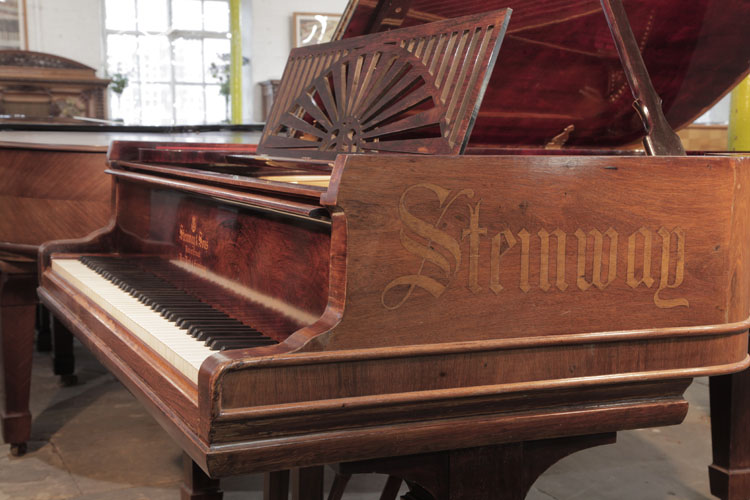 Piano cheek inlaid with the Steinway name in calligraphy style