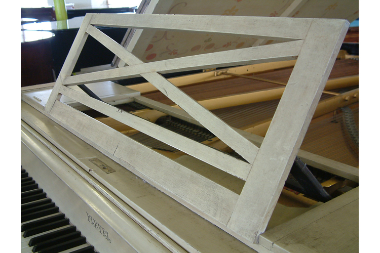Pleyel piano music desk in an openwork criss-cross design